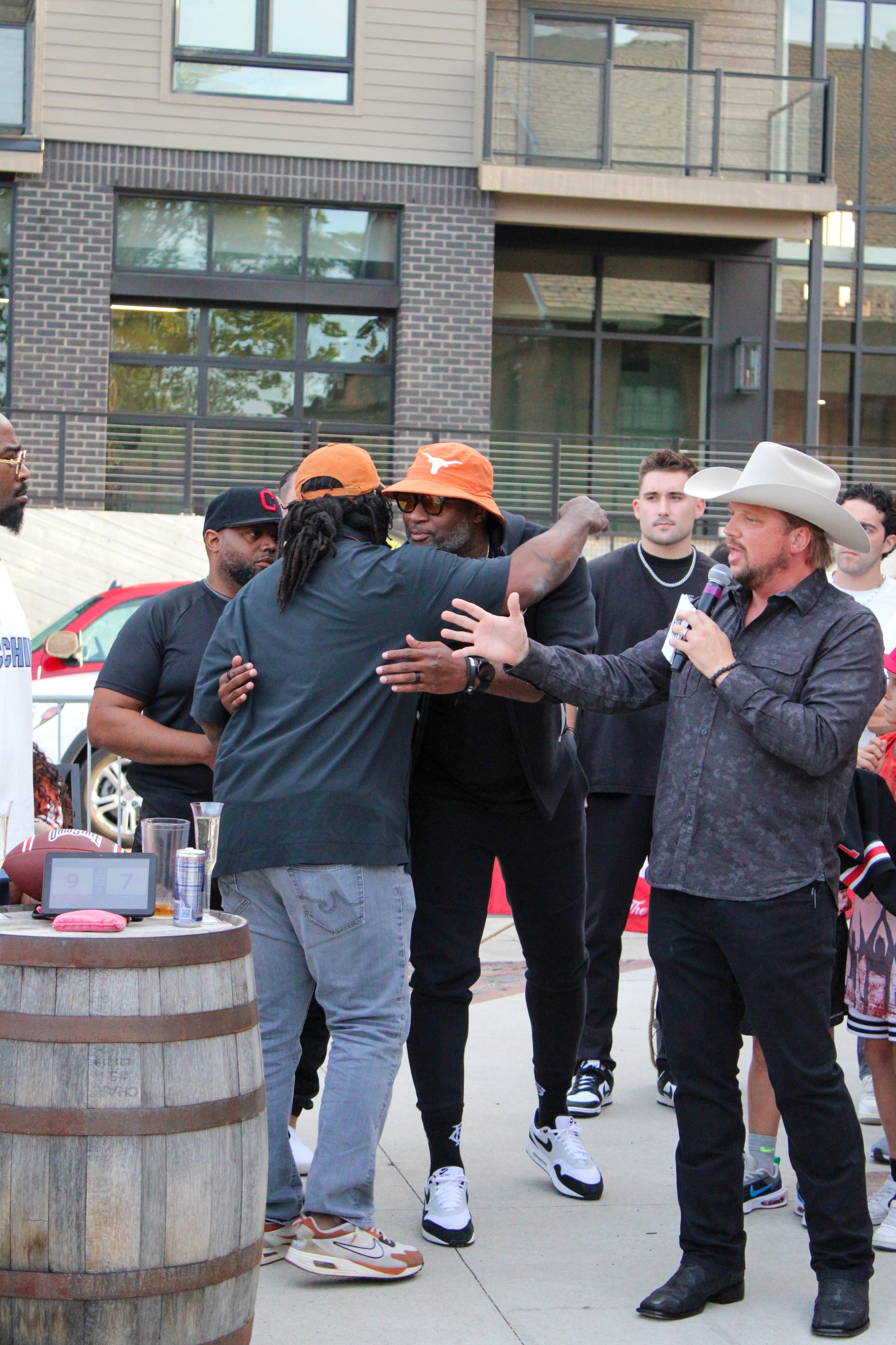 Group of attendees gathered at outdoor event venue