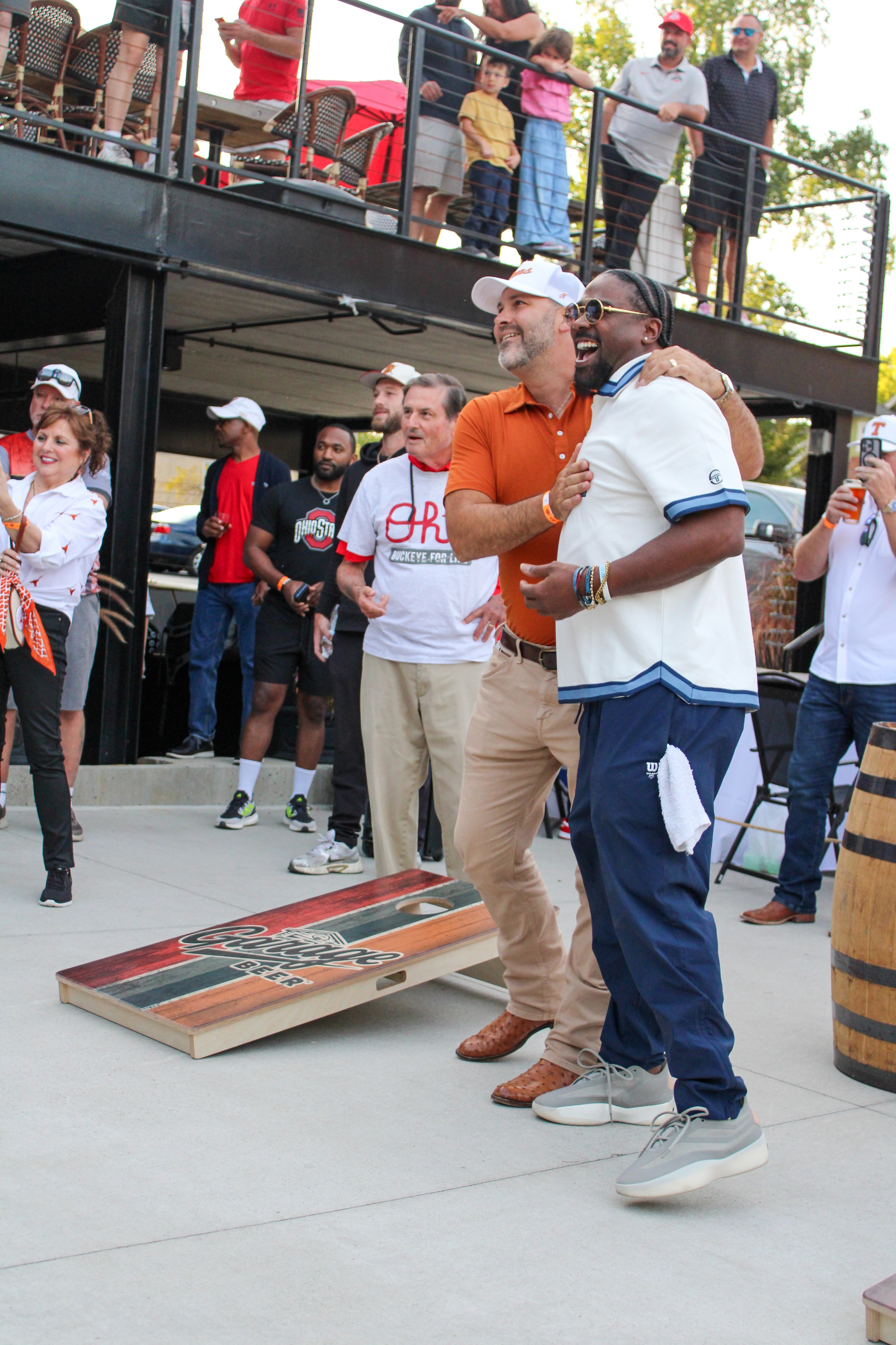 Football legends mingling with guests at the World Series of Cornhole event